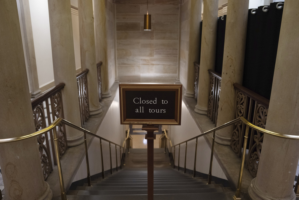 A sign at the top of the stairs near the plaque honoring police service on Jan. 6, 2021 at the Capitol, Saturday, March 7, 2026, in Washington. (AP Photo/Allison Robbert)