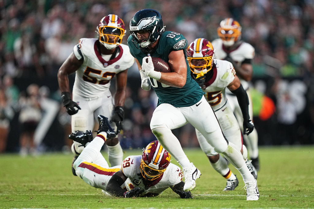 Philadelphia Eagles tight end Dallas Goedert (88) iuns for a touchdown against the Washington Commanders during the second half of an NFL football game, Sunday, Sept. 13, 2026, in Philadelphia. (AP Photo/Matt Rourke)