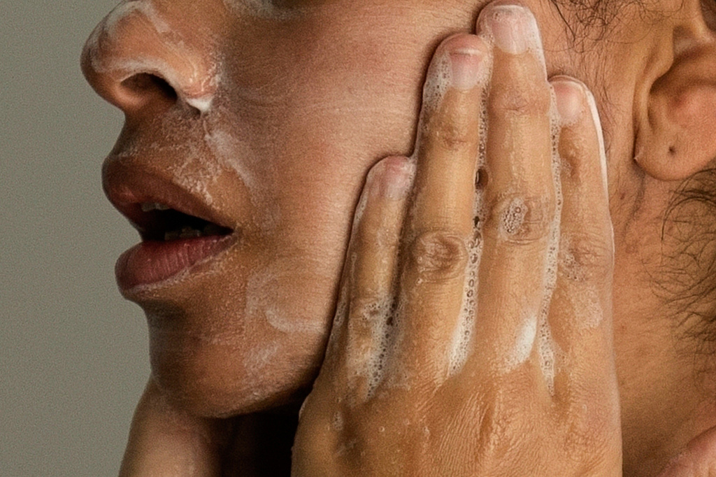FILE - A woman washes her face as she prepares for work in Chicago, on Friday, Feb. 10, 2023. (AP Photo/Erin Hooley, File)