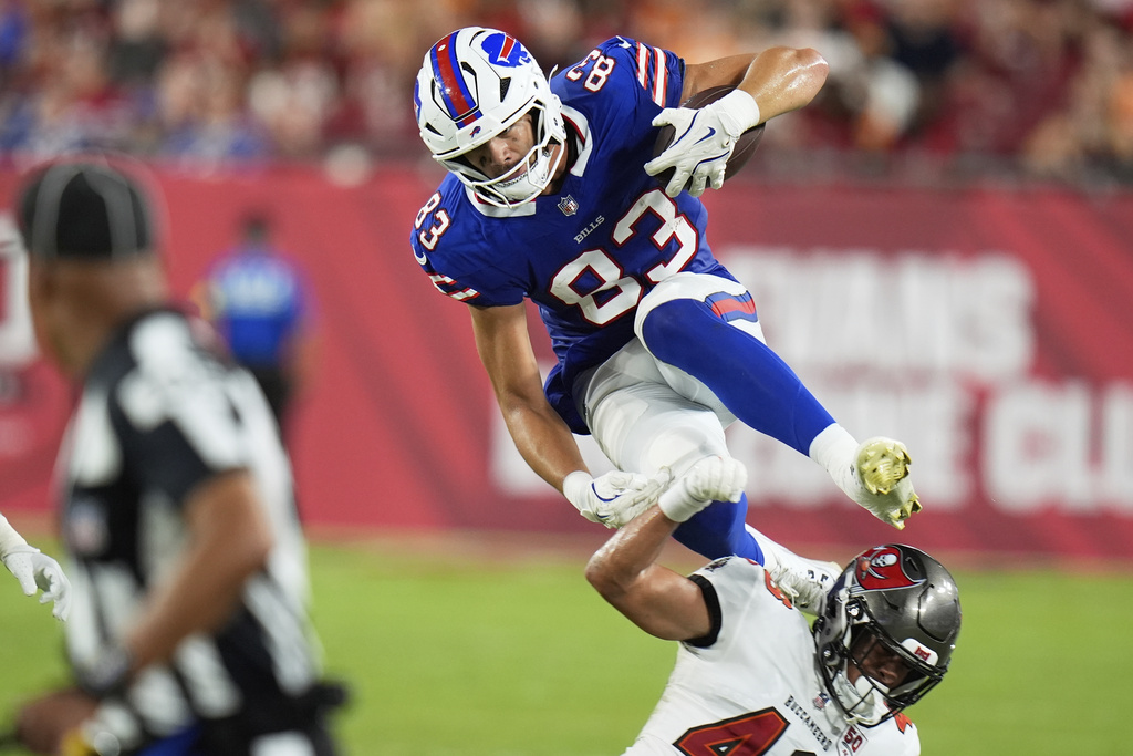 Buffalo Bills tight end Keleki Latu goes over Tampa Bay Buccaneers cornerback Roman Parodie during the second half of an NFL preseason football game, Saturday, Aug. 23, 2025, in Tampa, Fla. (AP Photo/Chris O'Meara)
