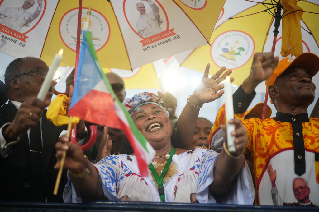 Faithful cheer for Pope Leo XIV during his meeting with young people and families at the stadium in Bata, Equatorial Guinea, Wednesday, April 22, 2026. (AP Photo/Andrew Medichini)
