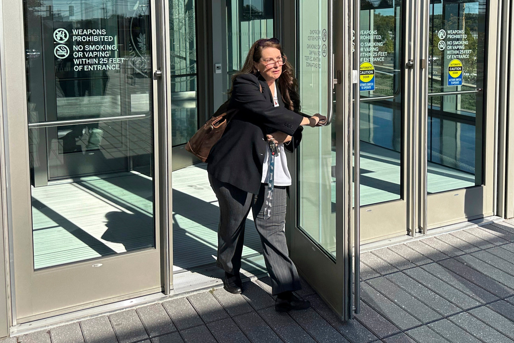 FILE - Heather Honey, a conservative election researcher, leaves the federal courthouse in Harrisburg, Pa., Oct. 18, 2024. (AP Photo/Mark Scolforo, file)