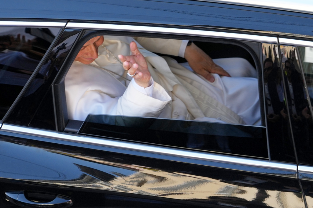 Pope Leo XIV waves as he leaves Pavia's Cathedral, northern Italy, Saturday, June 20, 2026. (AP Photo/Antonio Calanni)