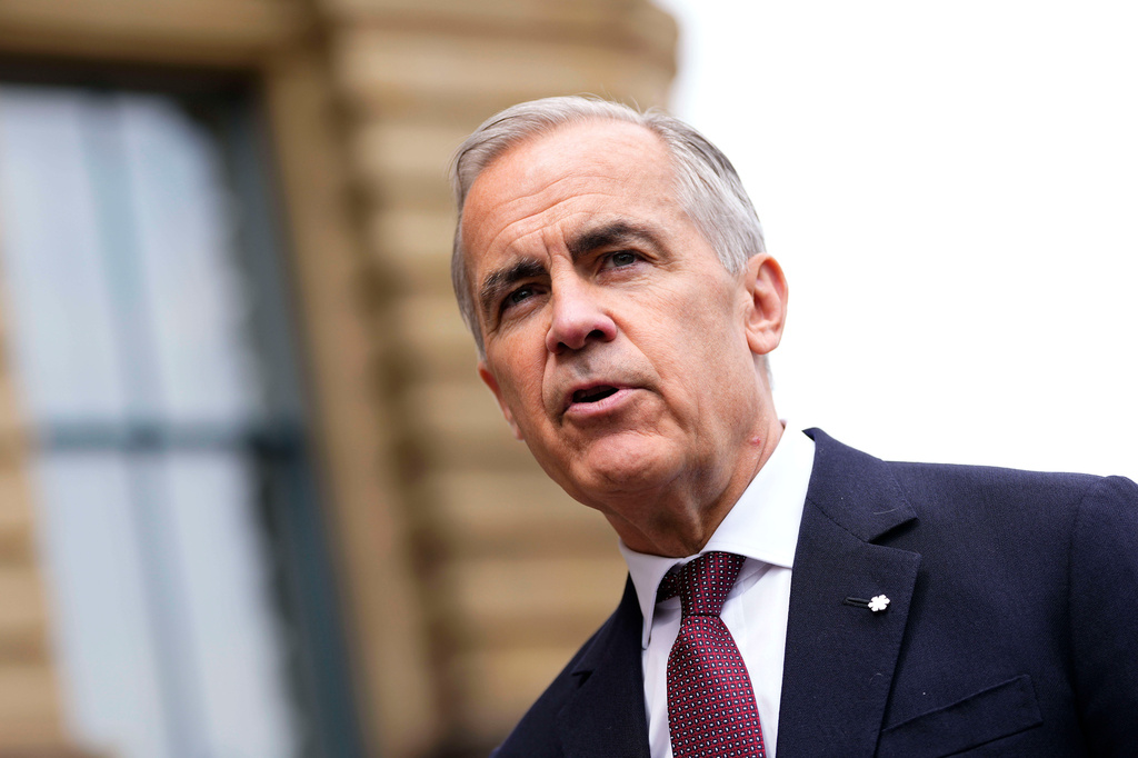 Prime Minister Mark Carney makes a statement outside the Office of the Prime Minister and Privy Council in Ottawa, on Tuesday, July 21, 2026. (Justin Tang/The Canadian Press via AP)