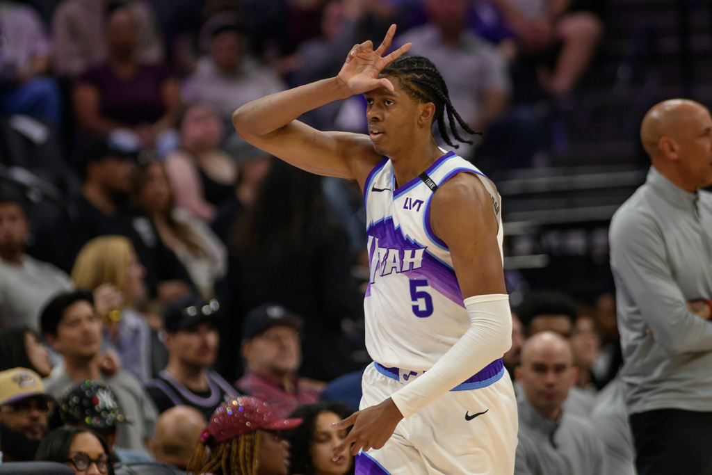 Utah Jazz forward Cody Williams (5) reacts after scoring a three point shot during the second half of an NBA basketball game against the Sacramento Kings in Sacramento, Calif., Sunday, March 15, 2026. The Kings won 127-106. (AP Photo/Randall Benton)