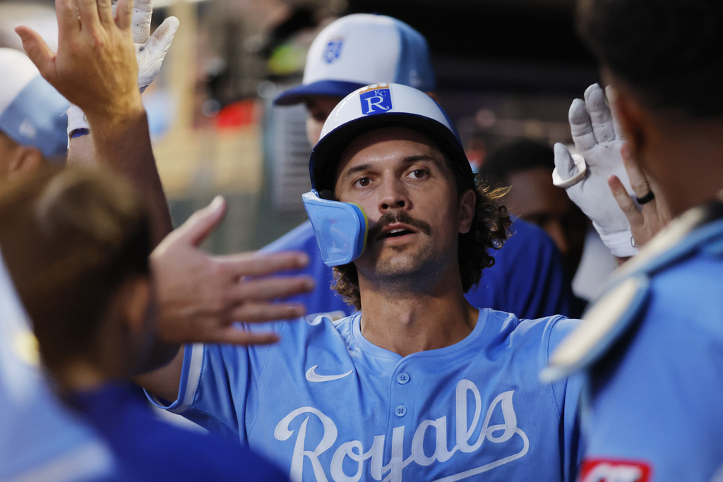Kansas City Royals' Adam Frazier celebrates after scoring against the Minnesota Twins on a Jonathan India single in the ninth inning of a baseball game Saturday, Aug. 9, 2025, in Minneapolis. (AP Photo/Bruce Kluckhohn)