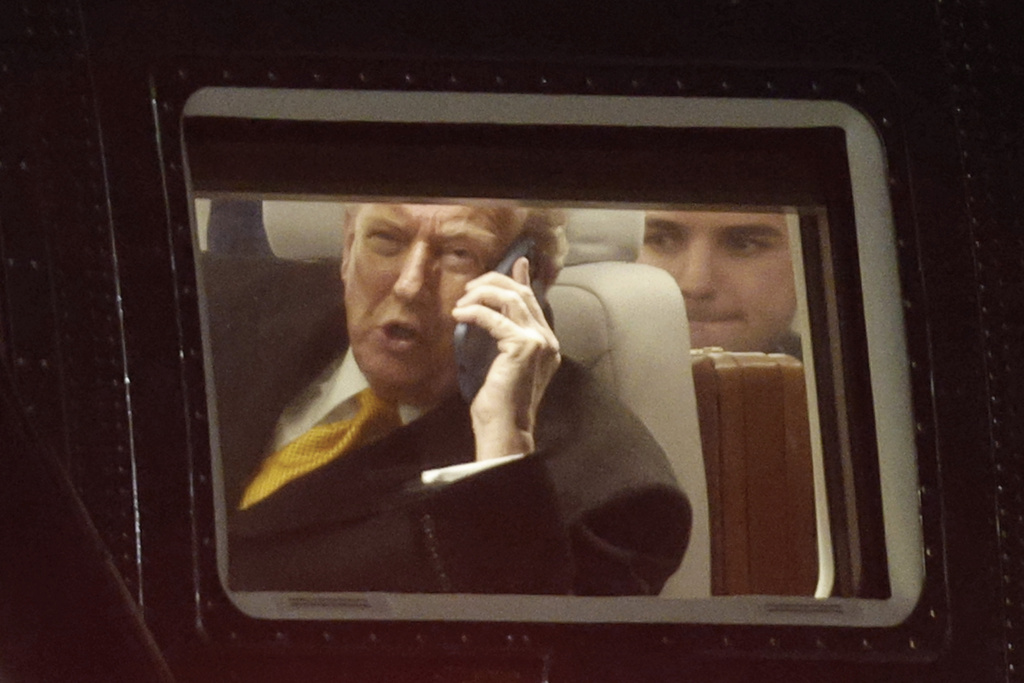 President Donald Trump talks on his phone in Marine One upon his arrival at Joint Base Andrews, Md., Friday, Nov. 7, 2025, en route to his Mar-a-Lago estate in Palm Beach, Fla. (AP Photo/Luis M. Alvarez)
