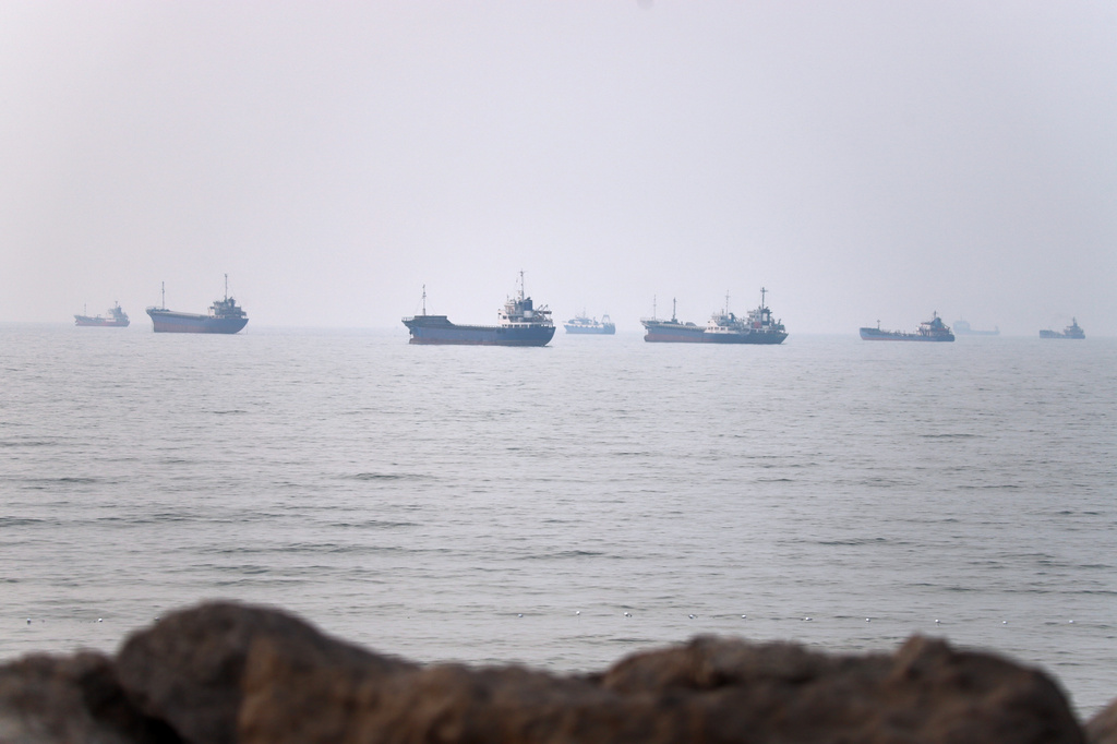 Commercial vessels are seen in the Strait of Hormuz off Bandar Abbas, Iran, Tuesday, June 30, 2026. (Amirhosein Khorgooi/ISNA via AP)