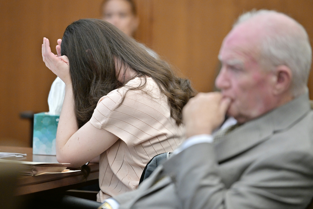 REMOVES REFERENCE TO PAVAO- Lindsay Clancy, left, reacts to the reading of her diary entries during testimony as her lawyer Kevin Reddington looks on, during her murder trial, Thursday, Aug. 13, 2026., in Plymouth, Mass. (AP Photo/Josh Reynolds, Pool)