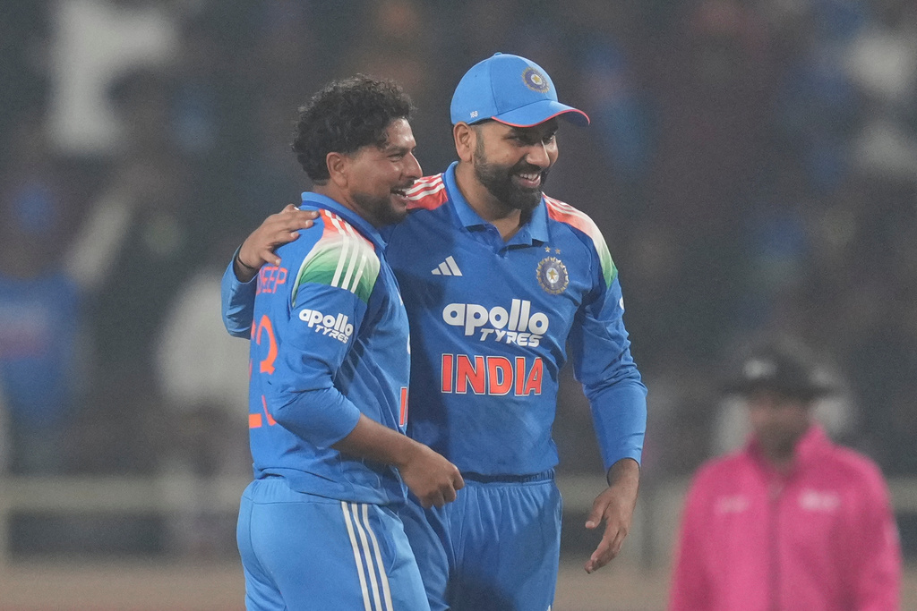India's Kuldeep Yadav, left, and India's Rohit Sharma celebrates the wicket of South Africa's Matthew Breetzke during the first One Day International match between India and South Africa in Ranchi, India, Sunday, Nov. 30, 2025. (AP Photo/Rafiq Maqbool)
