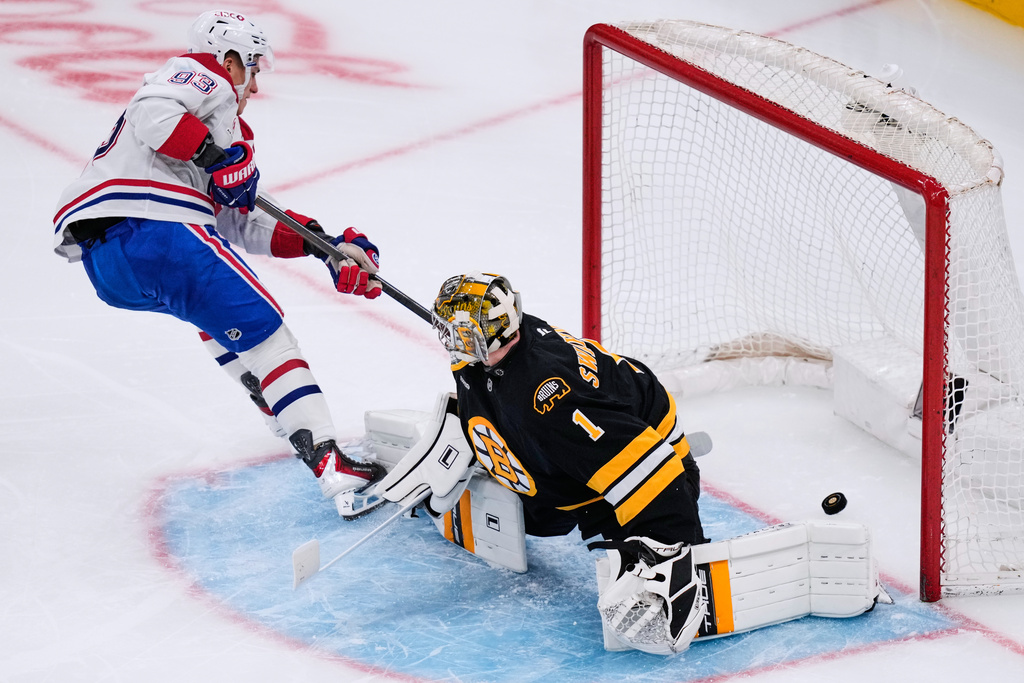 Montreal Canadiens right wing Ivan Demidov (93) scores on Boston Bruins goaltender Jeremy Swayman (1) during the second period of an NHL hockey game, Tuesday, Dec. 23, 2025, in Boston. (AP Photo/Charles Krupa)