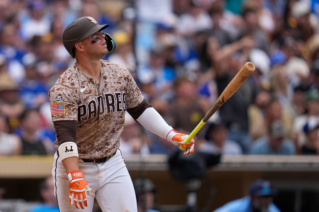 San Diego Padres' Ty France watches his sacrifice fly during the eighth inning of a baseball game against the Toronto Blue Jays Sunday, July 12, 2026, in San Diego. (AP Photo/Gregory Bull)