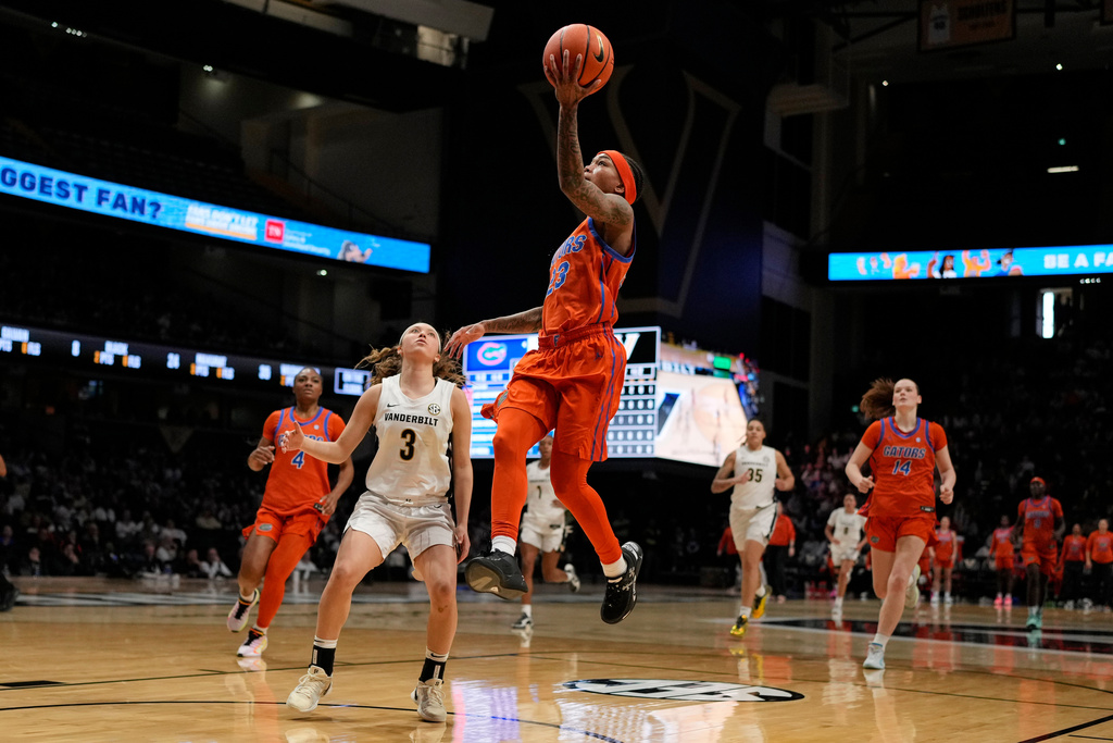 Florida guard Liv McGill (23) shoots the ball over Vanderbilt guard Aubrey Galvan (3) during the first half of an NCAA college basketball game Sunday, Feb. 1, 2026, in Nashville, Tenn. (AP Photo/George Walker IV)