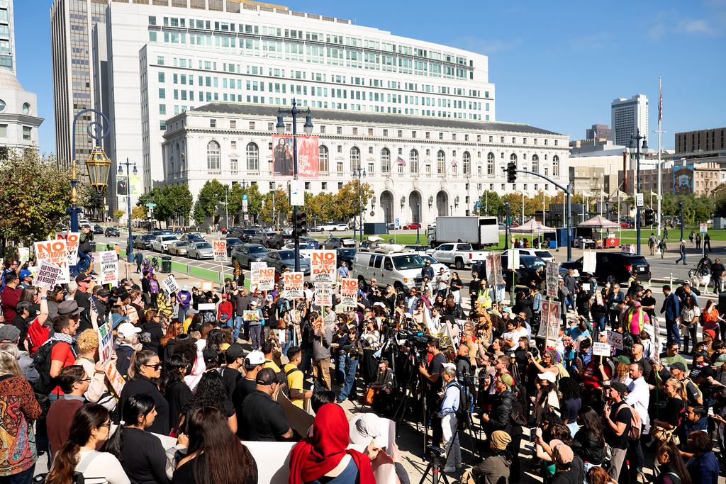 Protesters against U.S. Immigration and Customs Enforcement rally outside city hall on Thursday, Oct. 23, 2025, in San Francisco. (AP Photo/Noah Berger)