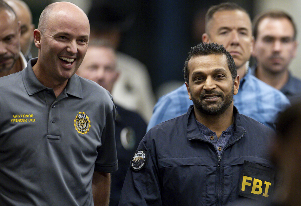 Utah Gov. Spencer Cox, left, and FBI Director Kash Patel, right, converse as they make their way to a press conference to speak to media about the shooting death of Charlie Kirk at Utah Valley University in Orem, Utah, on Thursday, Sept. 11, 2025. (Rio Giancarlo/The Deseret News via AP)