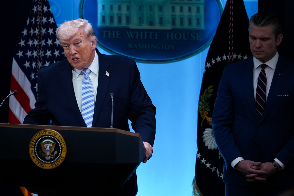 President Donald Trump, accompanied by Defense Secretary Pete Hegseth, speaks with reporters in the James Brady Press Briefing Room at the White House, Monday, April 6, 2026, in Washington. (AP Photo/Julia Demaree Nikhinson)