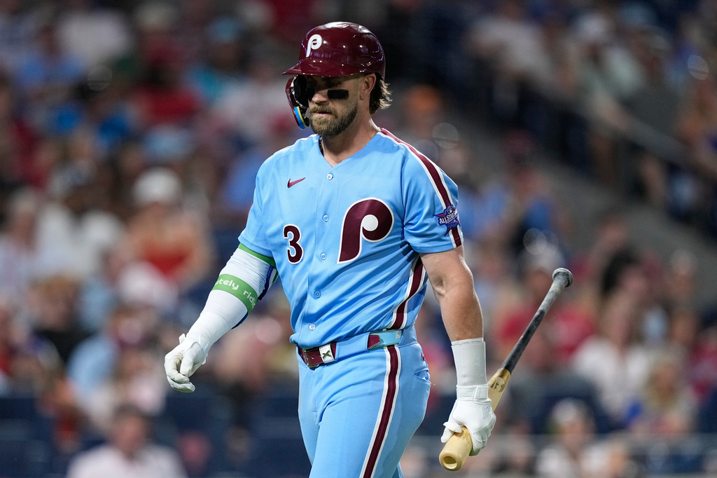 Philadelphia Phillies' Bryce Harper walks to the dugout after striking out against New York Mets pitcher Luke Weaver during the eighth inning of a baseball game Thursday, June 18, 2026, in Philadelphia. (AP Photo/Matt Slocum)