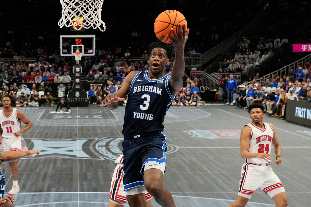 BYU forward AJ Dybantsa (3) shoots during the first half of an NCAA college basketball game against Houston in the quarterfinal round of the Big 12 Conference tournament Thursday, March 12, 2026, in Kansas City, Mo. (AP Photo/Charlie Riedel)