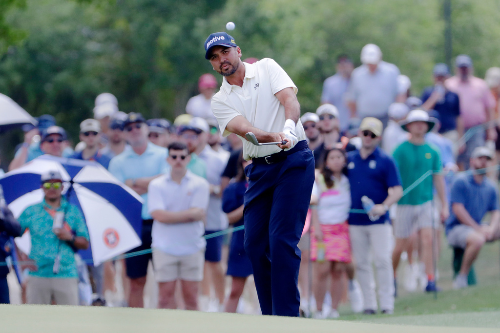Jason Day chips onto the eighth green during the final round of the Texas Children's Houston Open golf tournament Sunday, March 29, 2026, in Houston. (AP Photo/Michael Wyke)