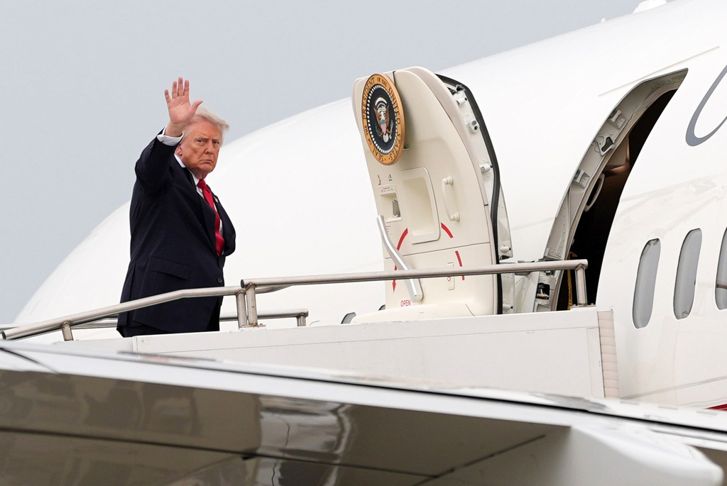 President Donald Trump waves as he departs on Air Force One at Oakland County International Airport, Monday, July 27, 2026, in Waterford Township, Mich. (AP Photo/Alex Brandon)
