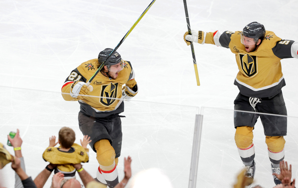 Vegas Golden Knights center Brett Howden, left, celebrates with Vegas Golden Knights defenseman Jeremy Lauzon (5) after scoring against the Utah Mammoth during second overtime of Game 5 in a first-round NHL hockey Stanley Cup playoff series Wednesday, April 29, 2026, in Las Vegas. (Steve Marcus/Las Vegas Sun via AP)