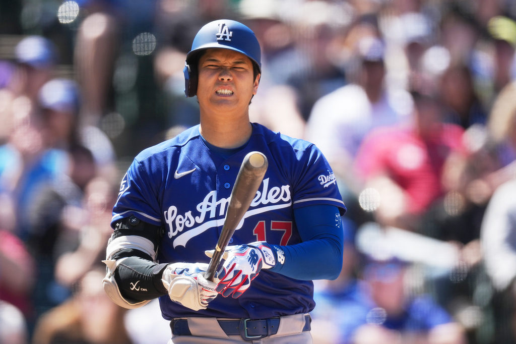 Los Angeles Dodgers' Shohei Ohtani reacts after fouling off a pitch from Colorado Rockies starter Michael Lorenzen in the fifth inning of a baseball game Sunday, April 19, 2026, in Denver. (AP Photo/David Zalubowski)