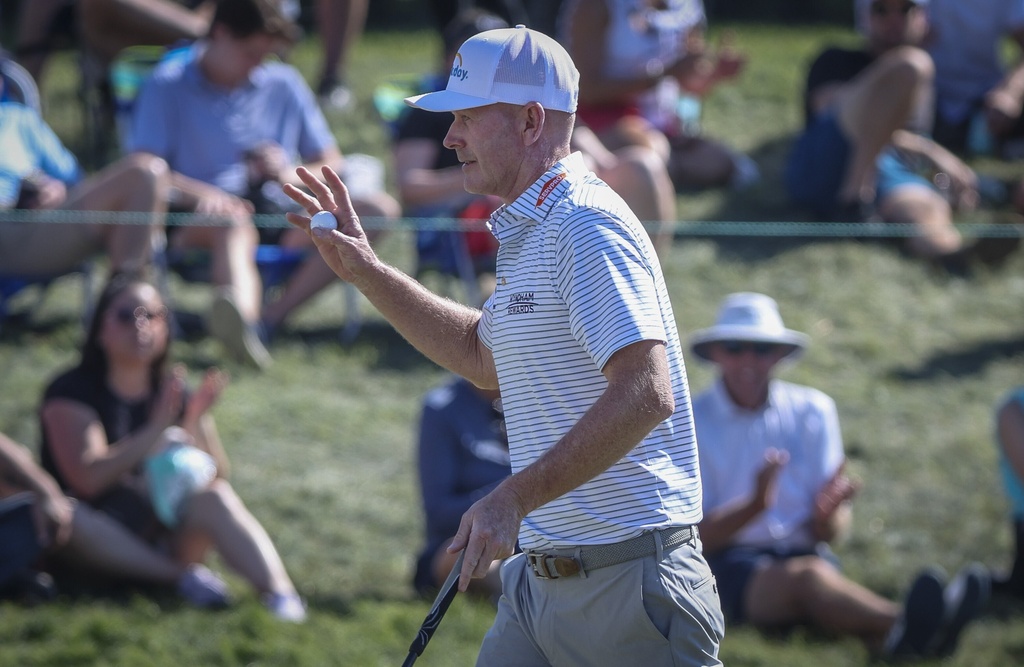 Brandt Snedeker waves to the crowd after his par putt on the 17th hole during the third round of the Valspar Championship golf tournament, Saturday, March 21, 2026, in Palm Harbor, Fla. (Chris Urso/Tampa Bay Times via AP)