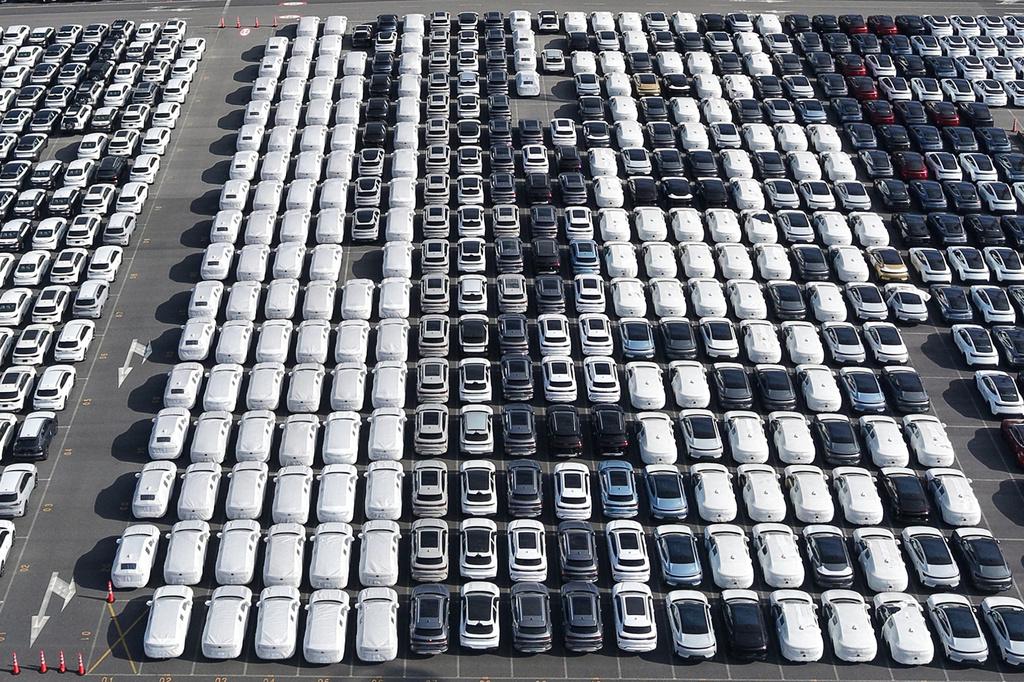 FILE - Aerial view of new cars waiting for shipment at a port in Shanghai, China, on Jan. 14, 2026. (Chinatopix via AP, File)