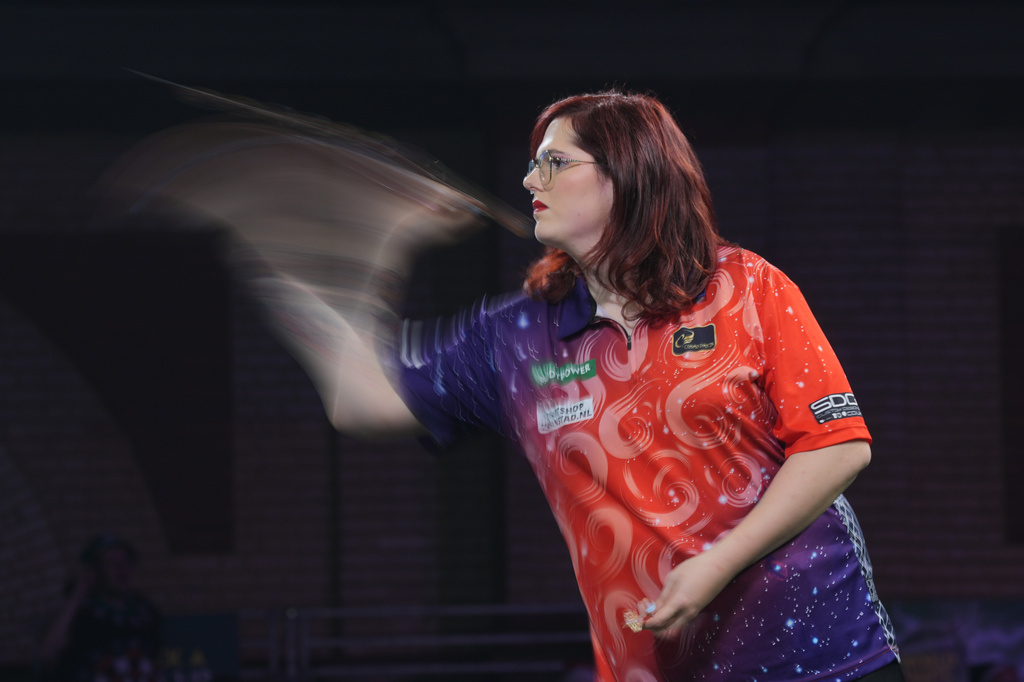 FILE - Noa-Lynn van Leuven, of the Netherlands, throws a dart as she takes part in a round one match at the World Darts Championships in London, Monday, Dec. 15, 2025. (AP Photo/Kin Cheung, File)