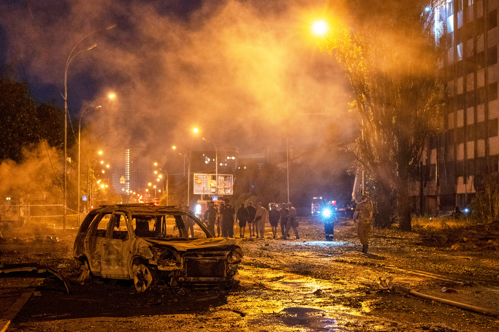 A burned car is seen after a Russian missile attack in Kyiv, Ukraine, Saturday, Aug. 1, 2026. (AP Photo/Dan Bashakov)