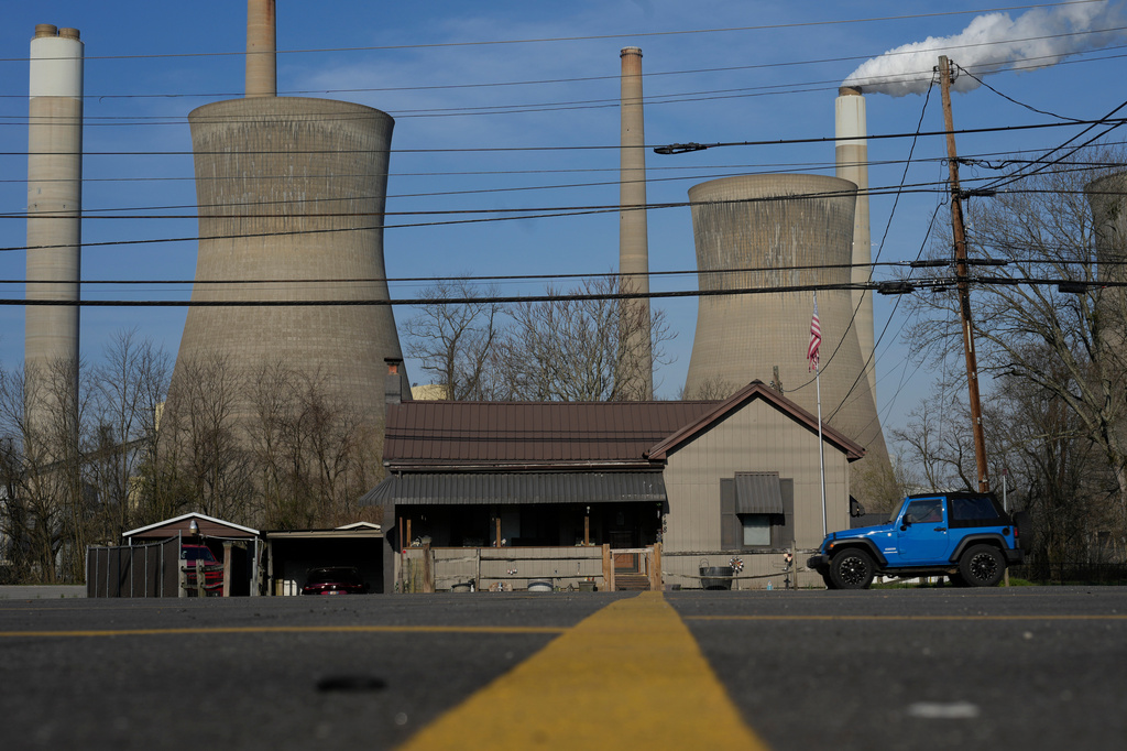 FILE - American Electric Power's John Amos coal-fired plant in Winfield, W.Va., is seen from Poca, W.Va., March 22, 2026. (AP Photo/Carolyn Kaster, File)
