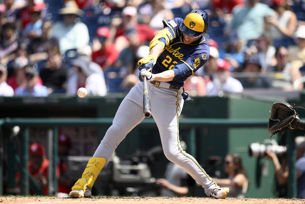 Milwaukee Brewers' Christian Yelich singles during the fifth inning of a baseball game against the Washington Nationals, Sunday, Aug. 3, 2025, in Washington. (AP Photo/Nick Wass)