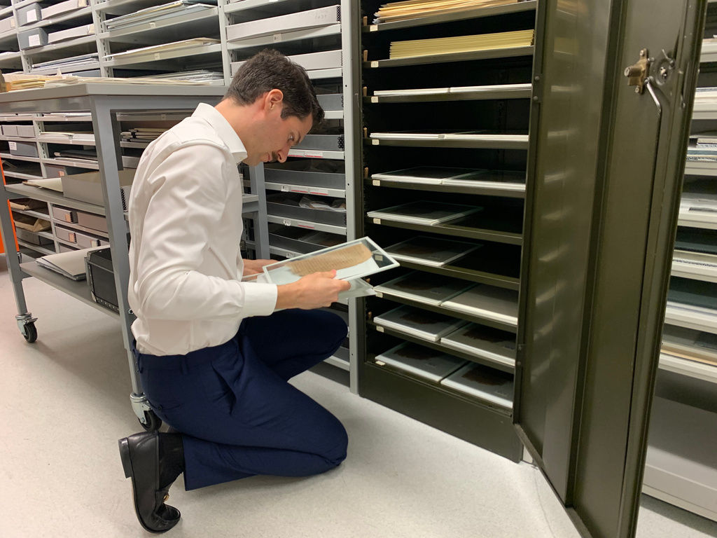 University of Michigan Papyrology Collection curator Giuliano Sidro looks at fragments of the Epistles of Paul Thursday, Aug. 6, 2026, in Ann Arbor, Mich. (AP Photo/Mike Householder)
