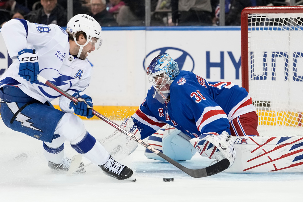 Tampa Bay Lightning left wing Brandon Hagel (38) shoots the puck during the second period of an NHL hockey game against New York Rangers, Saturday, Nov. 29, 2025, in New York. (AP Photo/Yuki Iwamura)