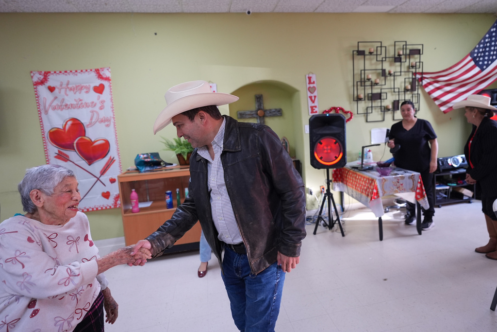 Democratic candidate for congress Bobby Pulido, right, makes a campaign stop in Pharr, Texas, Tuesday, Feb. 10, 2026. (AP Photo/Eric Gay)