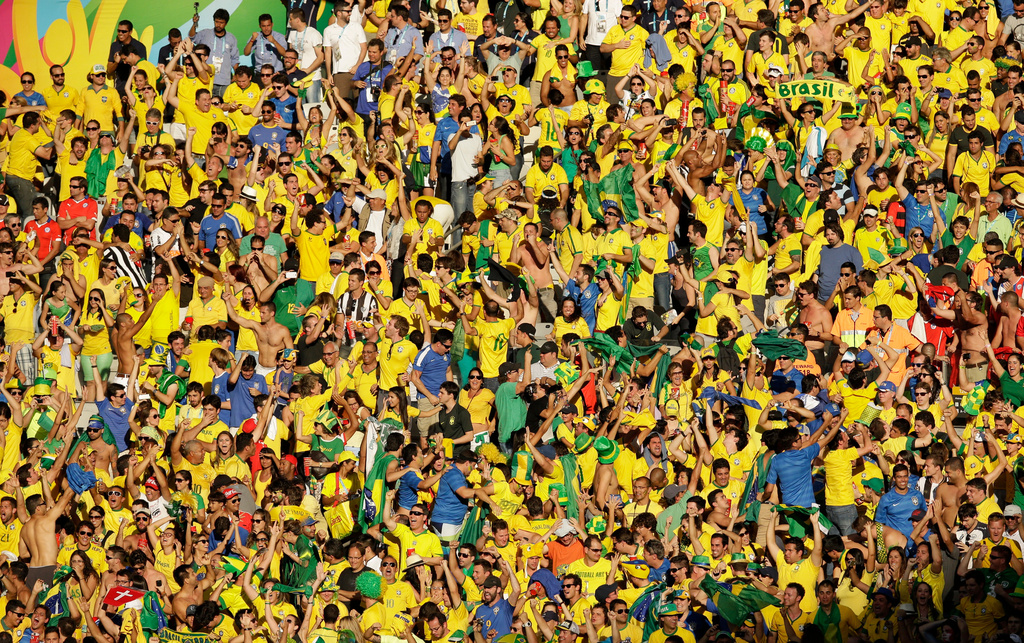 FILE -Brazil fans celebrate the World Cup round of 16 soccer match between Brazil and Chile at the Mineirao Stadium in Belo Horizonte, Brazil, June 28, 2014. (AP Photo/Hassan Ammar, File)