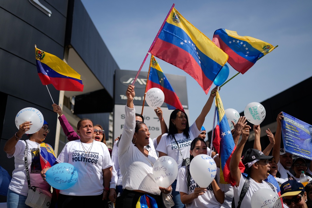 People attend a prayer for freedom of political prisoners, peace and reconciliation, in Caracas, Venezuela, Saturday, Feb. 7, 2026. (AP Photo/Ariana Cubillos)
