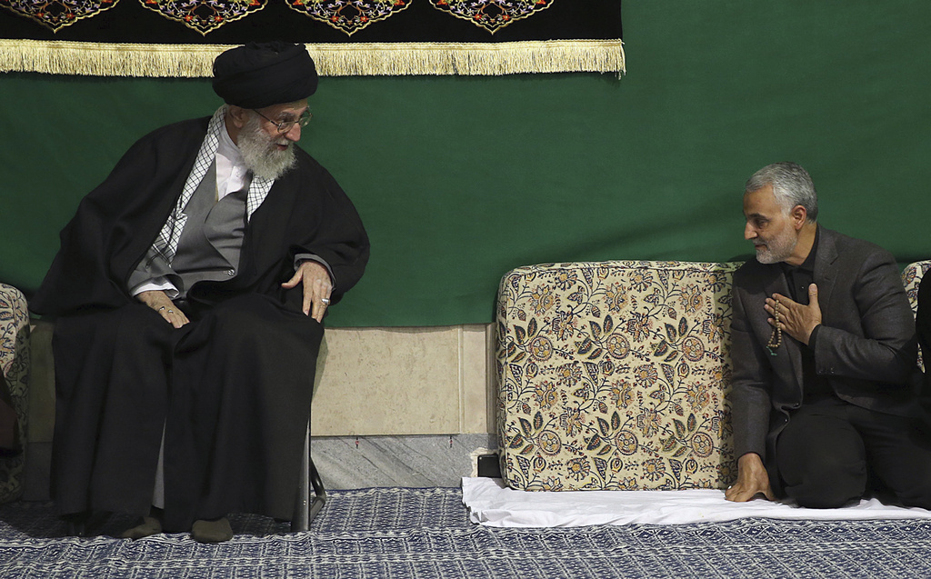FILE - In this photo released by the official website of the office of the Iranian supreme leader, commander of the Iran's Revolutionary Guard expeditionary Quds Force, Gen. Qassem Soleimani, right, greets Supreme Leader Ayatollah Ali Khamenei while attending a religious ceremony, in Tehran, Iran, March 27, 2015. (Office of the Iranian Supreme Leader via AP, File)