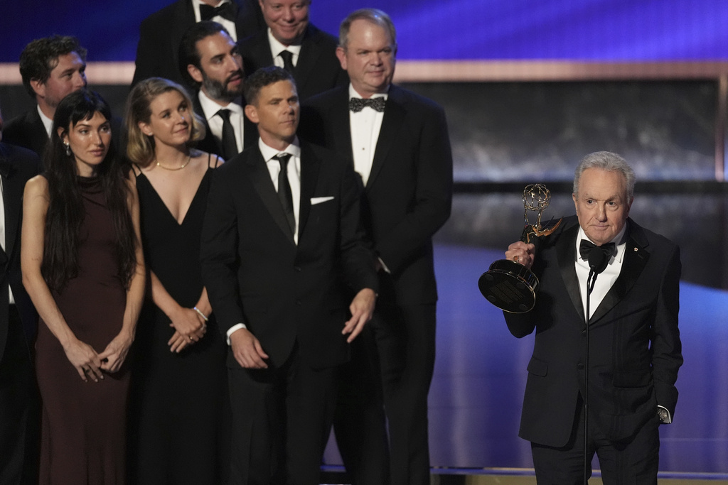 Lorne Michaels, right, and the cast and crew of "SNL50: The Anniversary Special" accepts the award for outstanding variety special (live) for during the 77th Primetime Emmy Awards on Sunday, Sept. 14, 2025, at the Peacock Theater in Los Angeles. (AP Photo/Chris Pizzello)