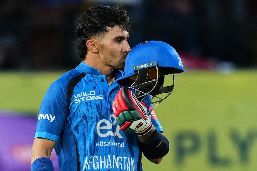 Afghanistan's Rahmanullah Gurbaz celebrates his century during the first ODI cricket match between Afghanistan and India in Dharamshala, India, Saturday, June 13, 2026. (AP Photo/Ashwini Bhatia)