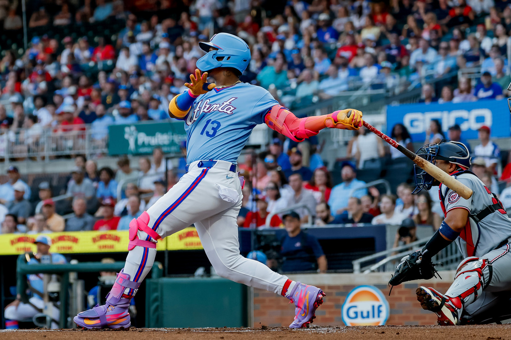 Atlanta Braves' Ronald Acuña Jr. (13) hits a solo home run against the Washington Nationals during the first inning of a baseball game, Saturday, Aug. 1, 2026, in Atlanta. (AP Photo/Erik S. Lesser)