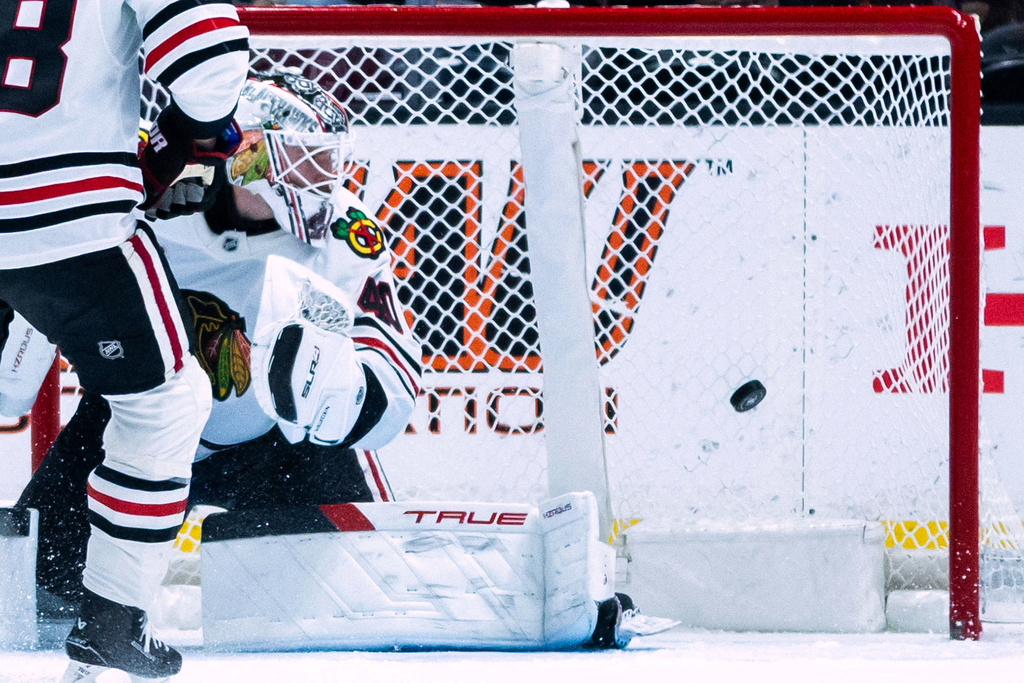 Chicago Blackhawks goaltender Arvid Soderblom (40) watches as the Anaheim Ducks score during the second period of an NHL hockey game Sunday, Dec. 7, 2025, in Anaheim, Calif. (AP Photo/Ethan Swope)