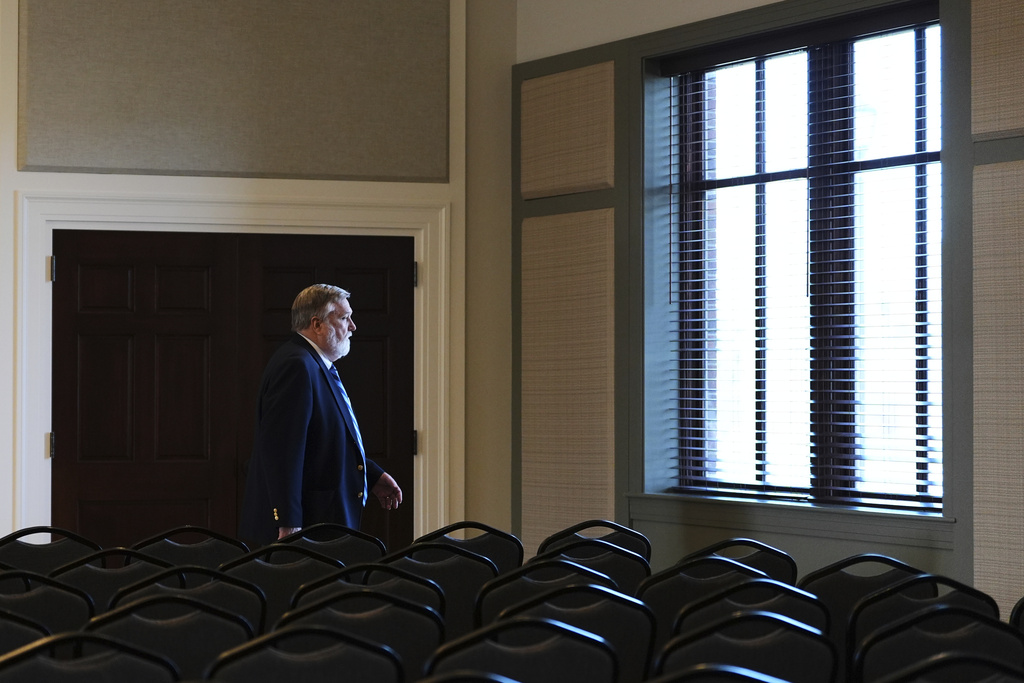 Pastor Doug Wilson walks through the church hall after Sunday services at the new campus for Christ Church and its Logos School, Sunday, April 6, 2025, in Moscow, Idaho. (AP Photo/Lindsey Wasson)