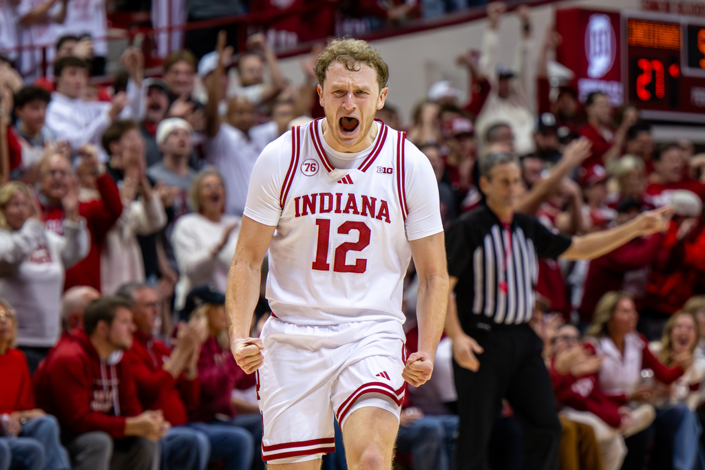 Indiana forward Tucker Devries reacts after scoring during the first half of an NCAA college basketball game against Purdue, Tuesday, Jan. 27, 2026, in Bloomington, Ind. (AP Photo/Doug McSchooler)