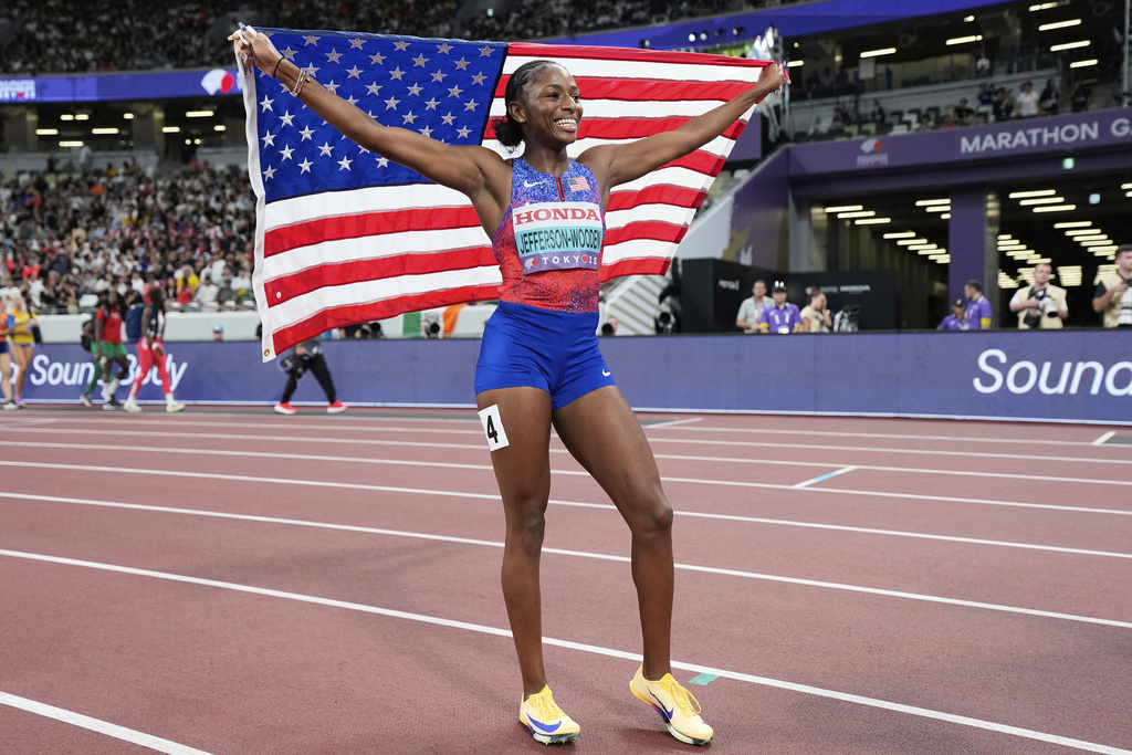 United States' Melissa Jefferson-Wooden reacts after winning the women's 100 meters final at the World Athletics Championships in Tokyo, Sunday, Sept. 14, 2025. (AP Photo/Ashley Landis)