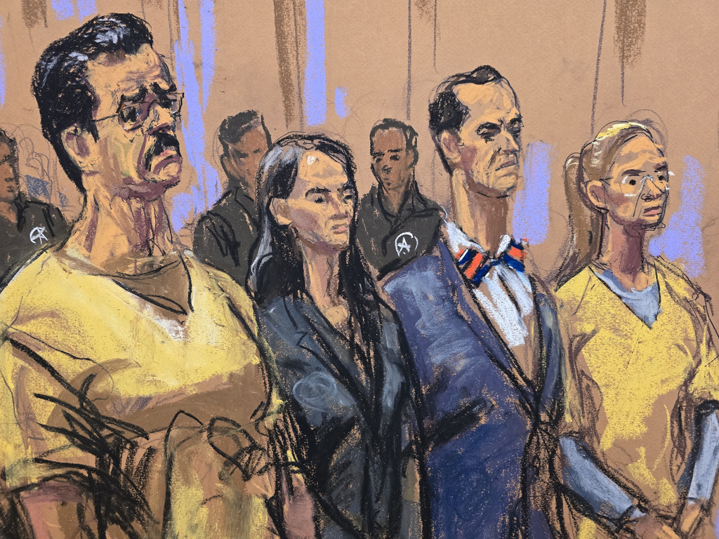 In this courtroom sketch, from left, former Venezuela President Nicholas Maduro, attorneys Anna Estevao and Mark Donnelly, and Maduro's wife, Cilia Flores, stand during a pretrial hearing in a drug trafficking case for Maduro and Flores, Wednesday, July 22, 2026, at Manhattan federal court in New York. (Jane Rosenberg via AP)