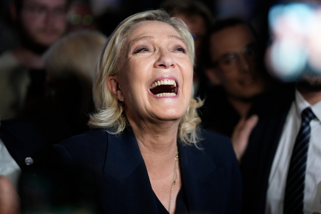 FILE - French far-right leader Marine Le Pen reacts as she meets supporters and journalists after the release of projections based on the actual vote count in select constituencies , Sunday, June 30, 2024 in Henin-Beaumont, northern France. (AP Photo/Thibault Camus, File)