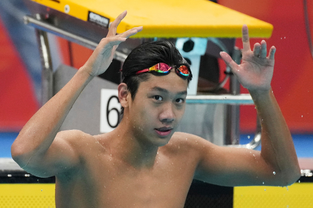 Zhang Zhanshuo of China reacts after winning the men's 400m freestyle swimming final at the Asian Games in Tokyo, Japan, Friday, Sept. 25, 2026. (AP Photo/Hiro Komae)