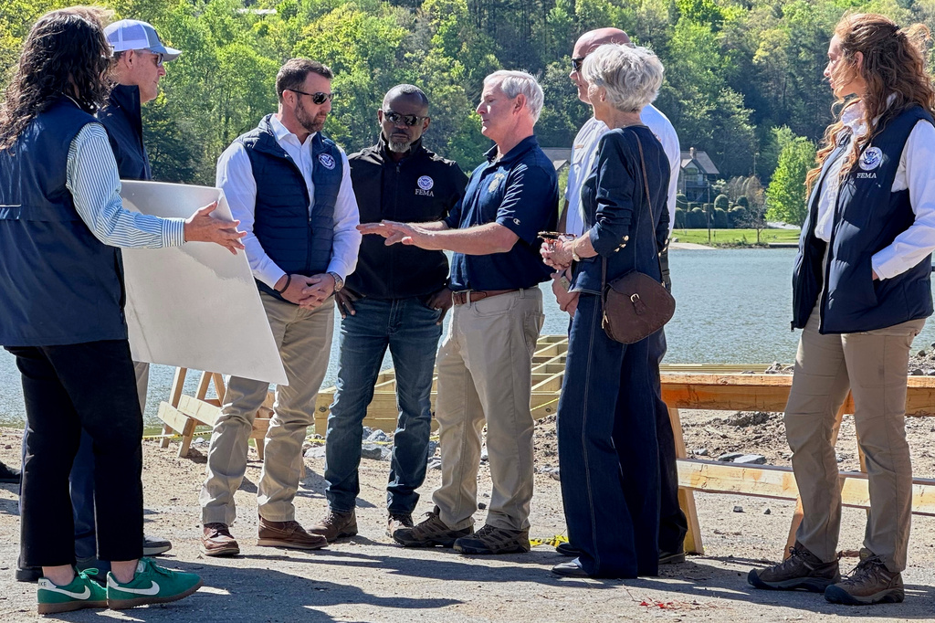 Homeland Security Secretary Markwayne Mullin, center left, listens to a briefing on hurricane recovery efforts, Tuesday, April 7, 2026 in Lake Lure, N.C. This is his first official trip since replacing Kristi Noem. (AP Photo Rebecca Santana)