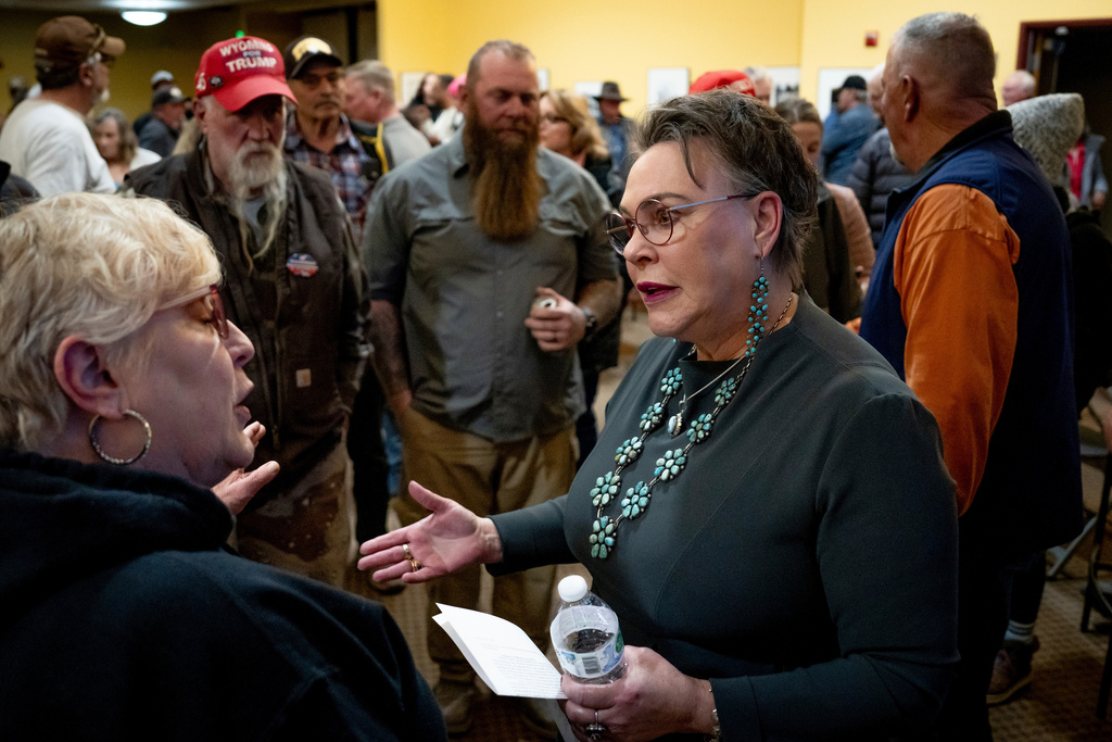 FILE - Rep. Harriet Hageman, R-Wyo., talks to attendees after holding a town hall meeting on March 14, 2025, in Evanston, Wyo. (AP Photo/Spenser Heaps, File)